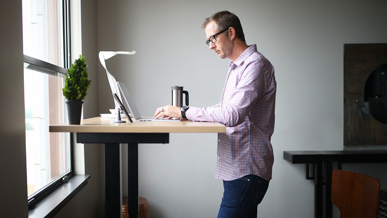 Man Working on Height Adjustable Standing Desk