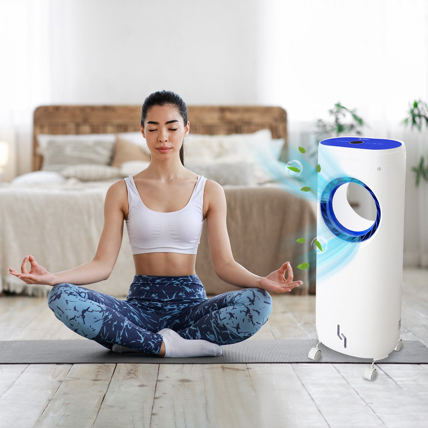 Girl sitting in yoga style beside the air cooler