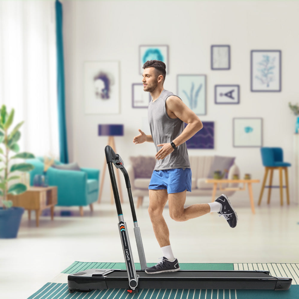 Man Running on Treadmill With Foldable Handlebar
